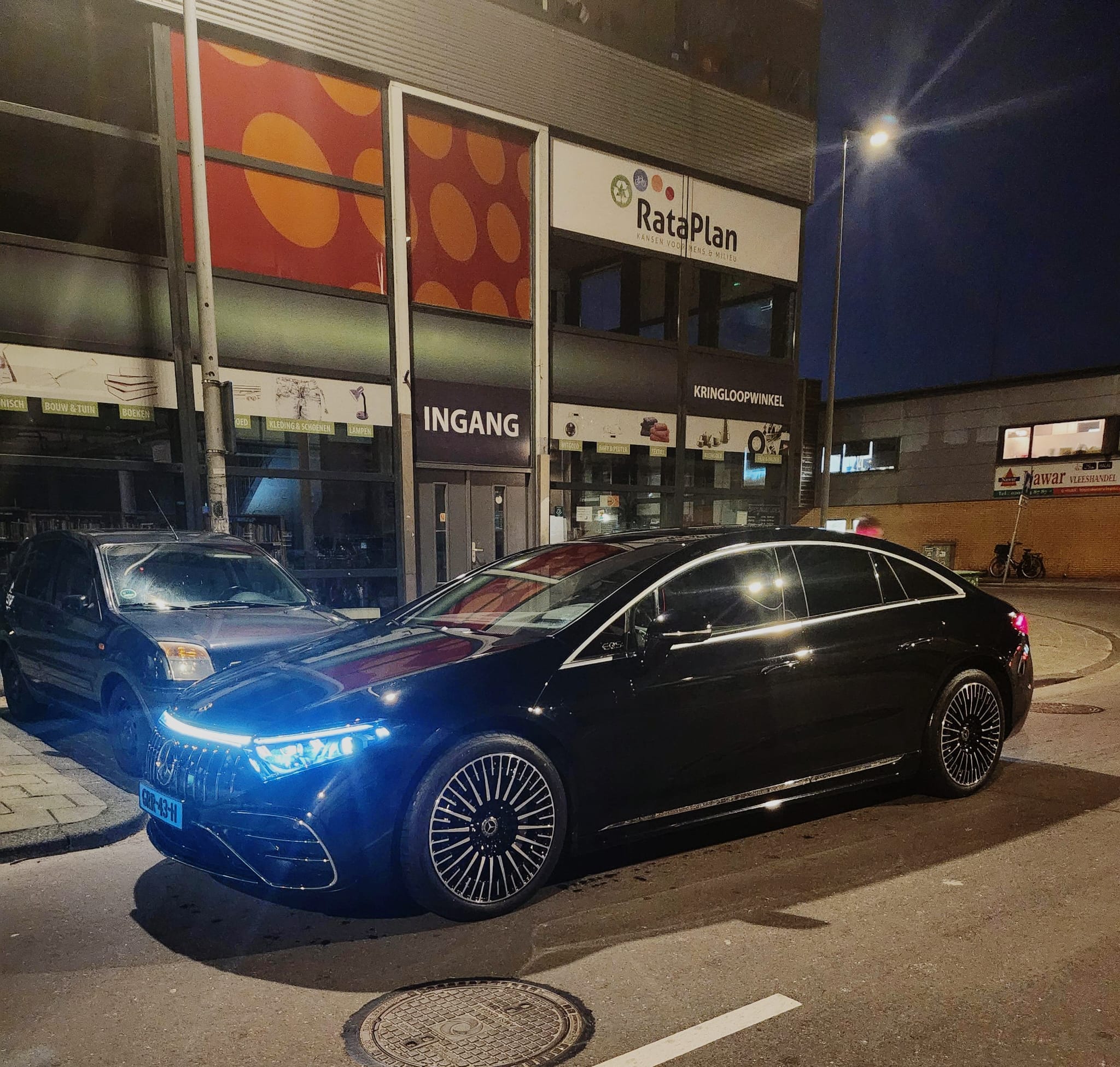 Mercedes-Benz EQS of the AmstelCab fleet at night in Amsterdam