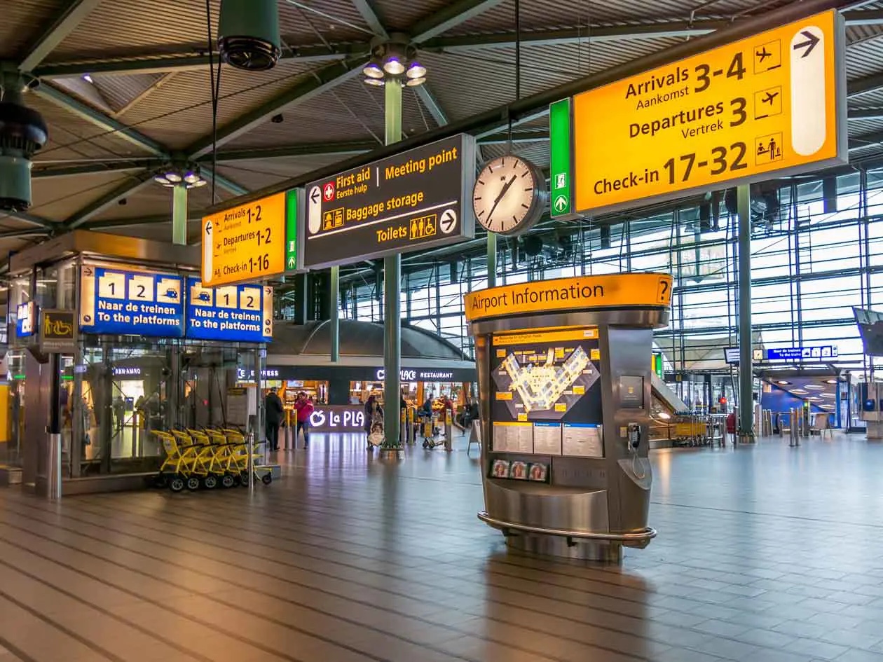 AmstelCab chauffeur meeting a passenger in the Schiphol arrivals hall