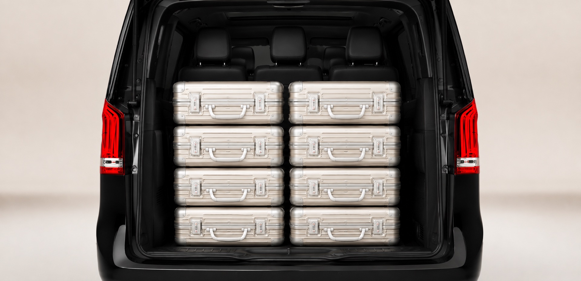 Trunk of an AmstelCab Mercedes V-Class loaded with standard check-in suitcases
