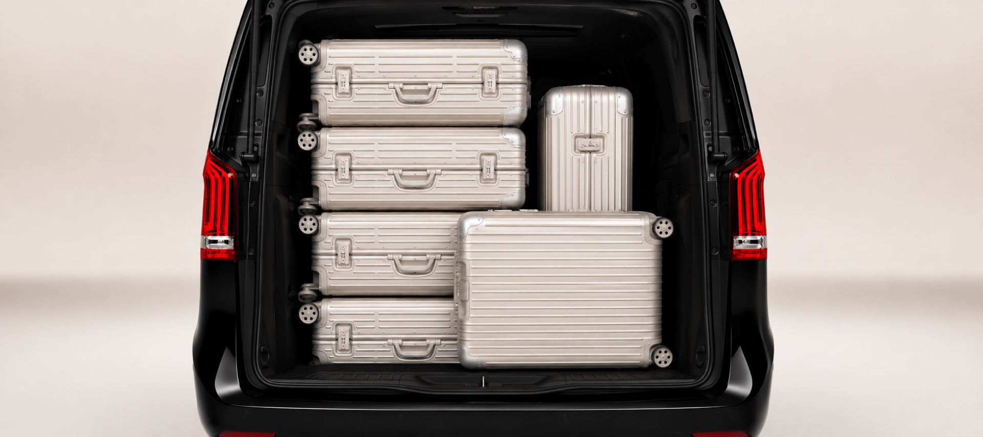 Trunk of an AmstelCab Mercedes V-Class loaded with extra-large cases