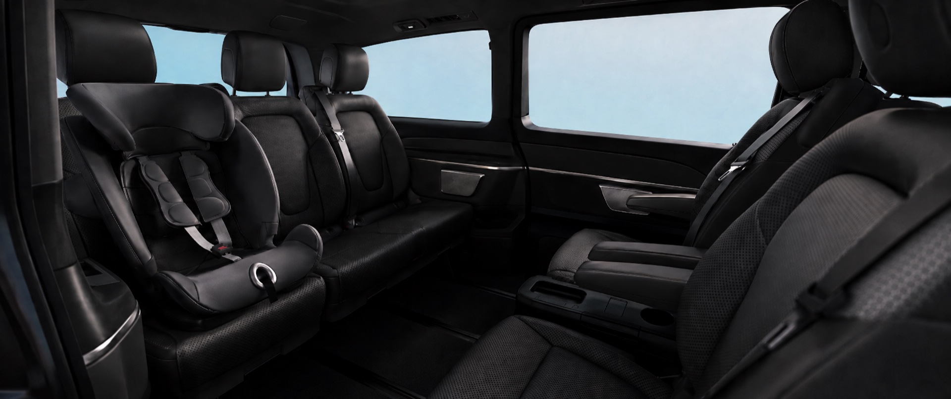 Rear cabin of the AmstelCab Mercedes V-Class with a child seat fitted on the bench behind the captain chairs